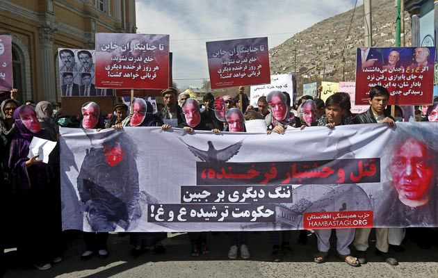 Afghans from the Hmbastagi party (Solidarity Party of Afghanistan) wear masks during a protest to condemn the killing of 27-year-old woman, Farkhunda, in Kabul.