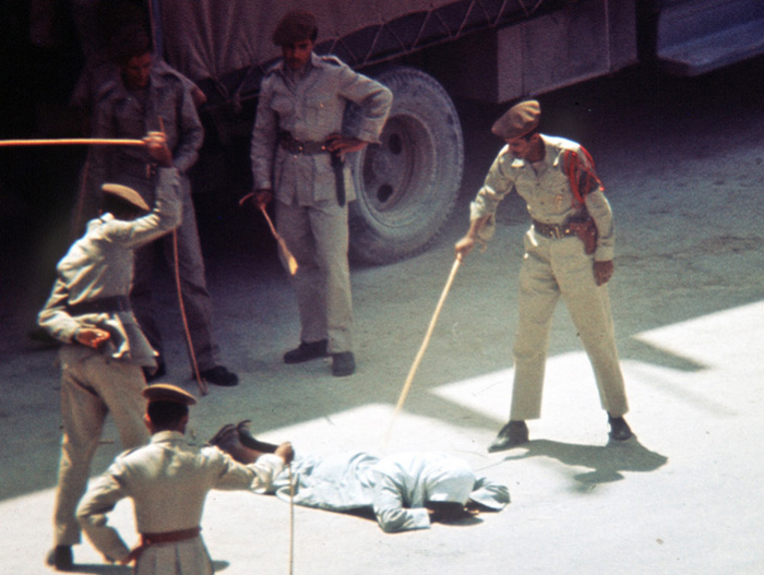 Saudi police take turns caning a man convicted under sharia law